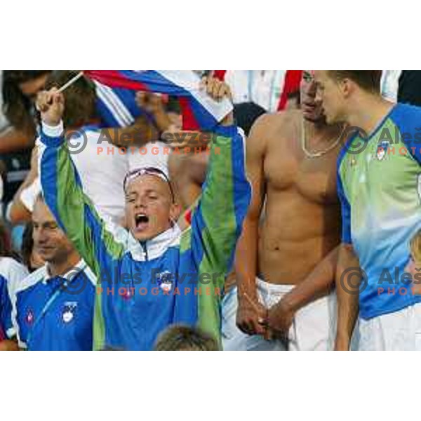 Emil Tahirovic and swimmers of Slovenia cheering at Athens 2004 Summer Olympic games in Athens, Greece on August 18, 2004