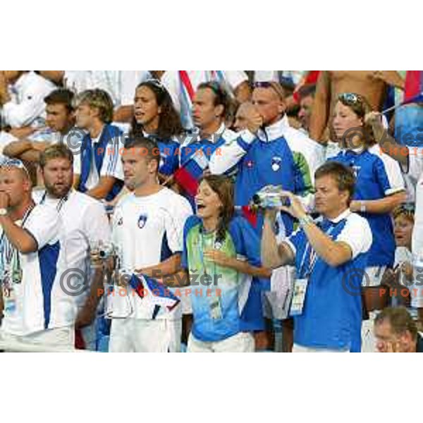 Peter Mankoc, Sara Isakovic and swimmers of Slovenia cheering at Athens 2004 Summer Olympic games in Athens, Greece on August 18, 2004