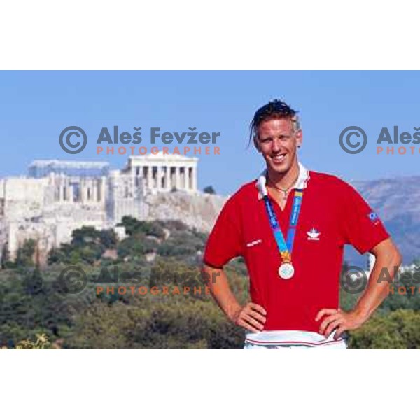 Luka Spik of Slovenia, silver medalist in rowing at Summer Olympic Games in Athens, Greece , August 2004 pictured in front of Acropolis 
