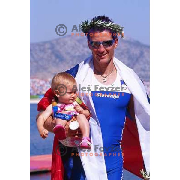 Iztok Cop of Slovenia, silver medalist in rowing at Summer Olympic Games in Athens, Greece , August 2004 pictured with his daughter Ruby 