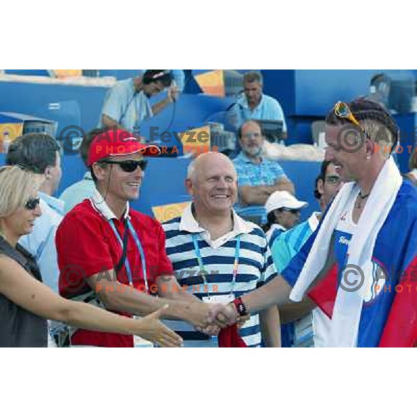 Luka Spik of Slovenia, silver medalist in rowing at Summer Olympic Games in Athens, Greece , August 2004 receives congratulations from Tone Jagodic and Janez Kocijancic 