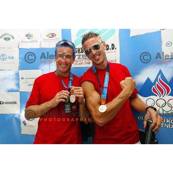 Iztok Cop and Luka Spik of Slovenia, silver medalist in rowing at Summer Olympic Games in Athens, Greece , August 2004 during reception for sponsors and press in Slovenia house 