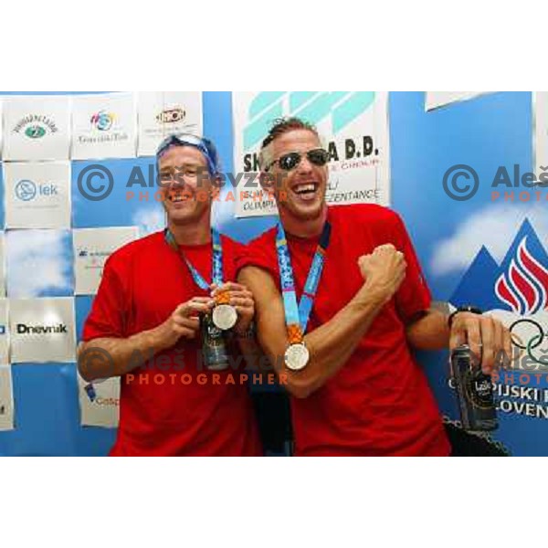 Iztok Cop and Luka Spik of Slovenia, silver medalists in rowing at Summer Olympic Games in Athens, Greece , August 2004 during reception for sponsors and press in Slovenia house 
