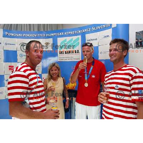 Nada Rotovnik Kozjek, Luka Spik of Slovenia, silver medalist in rowing at Summer Olympic Games in Athens, Greece , August 2004 during reception for sponsors and press in Slovenia house 