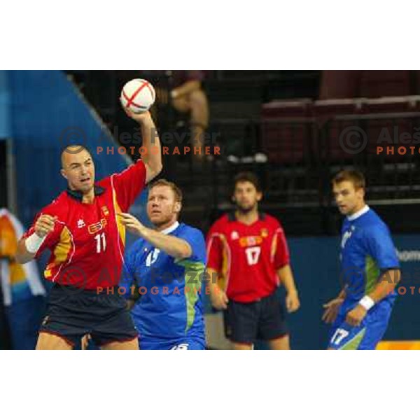 Lozano of Spain and Ales Pajovic of Slovenia in action during Handball tournament at Summer Olympic Games Athens 2004, Greece. Slovenia played with Spain on August 20, 2004 
