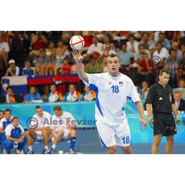 Uros Zorman of Slovenia in action during Handball tournament at Summer Olympic Games Athens 2004, Greece. Slovenia played with Russia on August 13, 2004 