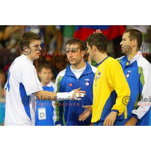 Sergej Rutenka, Tomaz Tomsic,Beno Lapajne of Slovenia during Handball tournament at Summer Olympic Games Athens 2004, Greece. Slovenia played with Russia on August 13, 2004 