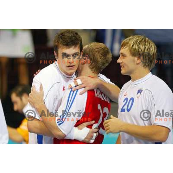 Sergej Rutenka, Luka Zvizej of Slovenia during Handball tournament at Summer Olympic Games Athens 2004, Greece. Slovenia played with Russia on August 13, 2004 