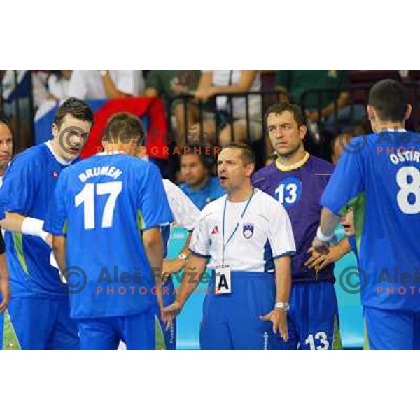 Sergej Rutenka,Tone Tiselj, coach of Slovenia, Tomaz Tomsic in action during Handball tournament at Summer Olympic Games Athens 2004, Greece. Slovenia played with Croatia on August 15, 2004 