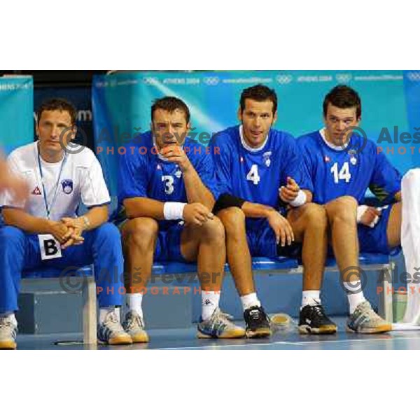 Marko Sibila, Tomaz Tomsic, Renato Vugrinec, Sergej Rutenka of Slovenia during Handball tournament at Summer Olympic Games Athens 2004, Greece. Slovenia played with Croatia on August 15, 2004 