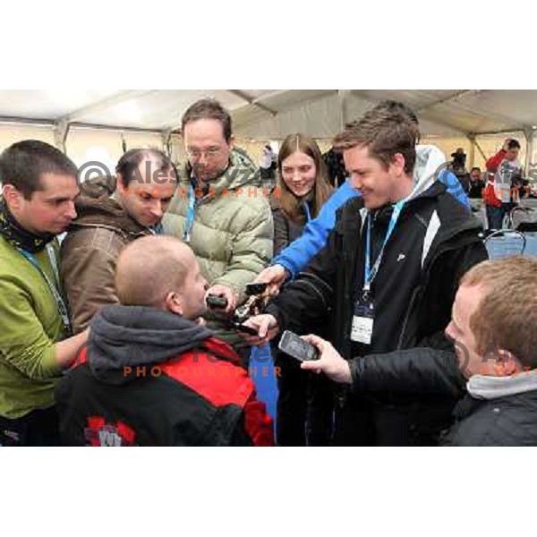 Journalists in the press center talking to Eddie "the Eagle" Edwards, british ski jumper who competed at 1988 Winter Olympic games visited with his family FIS World Cup Ski Jumping Final in Planica, Slovenia on March 20, 2011 